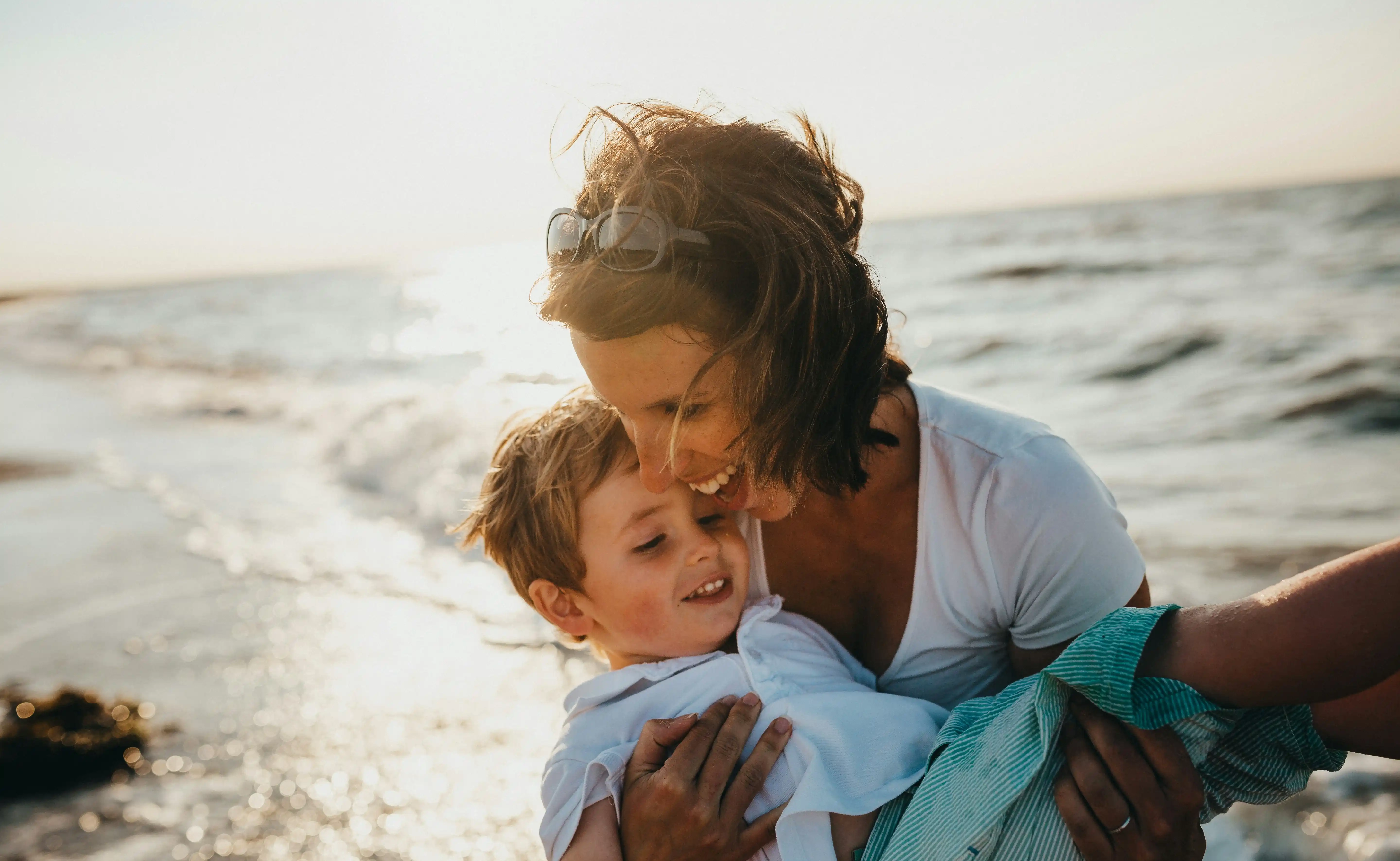 A lady and her son enjoying their day by the sea